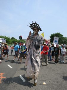 A People's Climate Marcher on Stilts